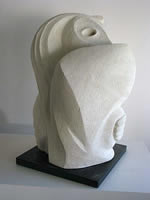 Sculpture of nude female carved in limestone entitled 'Squeeze'
